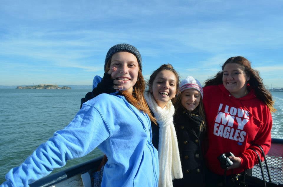 Girls on a boat in San Francisco with Alcatraz