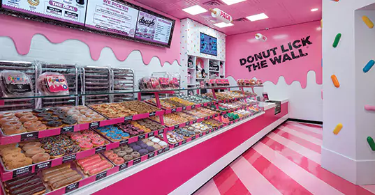 Pinkbox Doughnuts inside the store with donut display