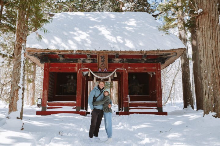 Couple at Togakushi Shrine Nagano in the snow