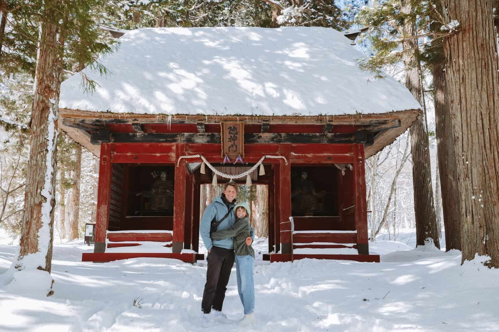 Couple at Togakushi Shrine Nagano in the snow